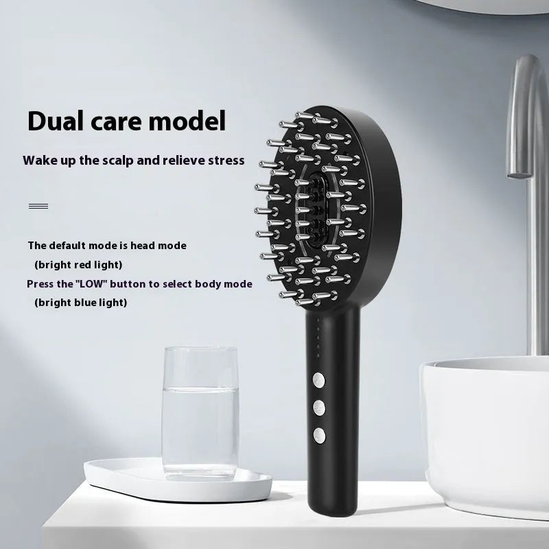 Handheld black scalp massage device with charging cable on a white background.