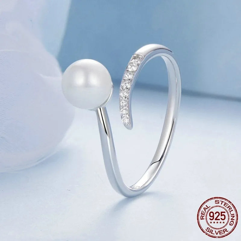 Sterling silver adjustable ring with genuine freshwater shell pearl on minimalist band