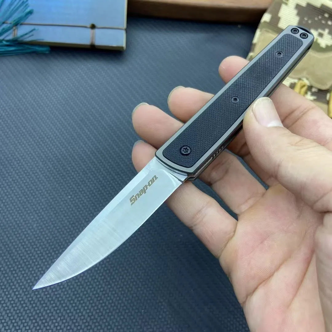 Folding fruit knife with stainless steel blade in black, coffee or red colour options showing extended and folded positions