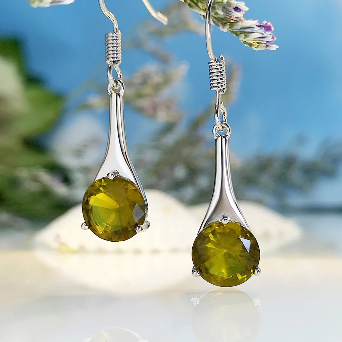 Olive green topaz water drop shaped earrings with electroplated finish and retro styling