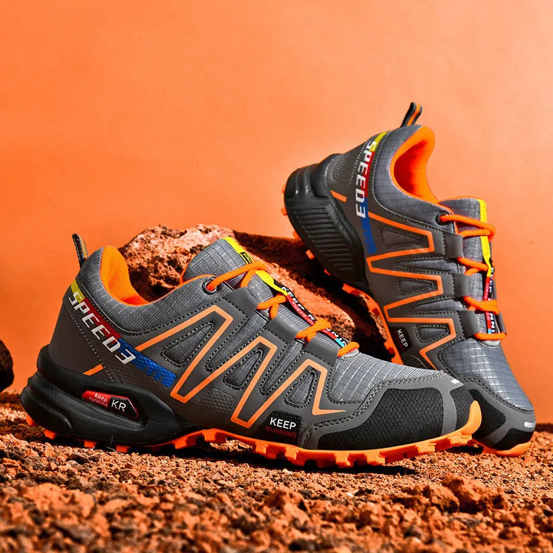 Men's grey-orange plus size casual shoes with synthetic leather upper and rubber sole.
