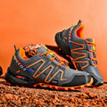 Men's grey-orange plus size casual shoes with synthetic leather upper and rubber sole.