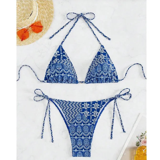 Women's green split bikini swimsuit with bandage-style printed stitching and briefs bottom.