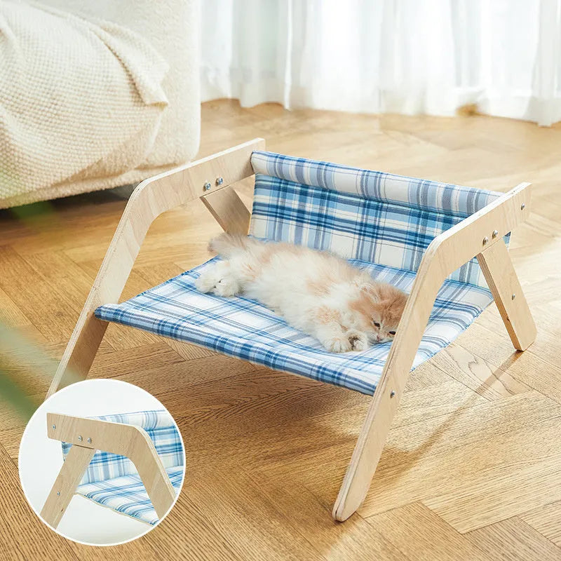 Wooden cat hammock bed with elevated design and cloth sleeping surface in blue colour