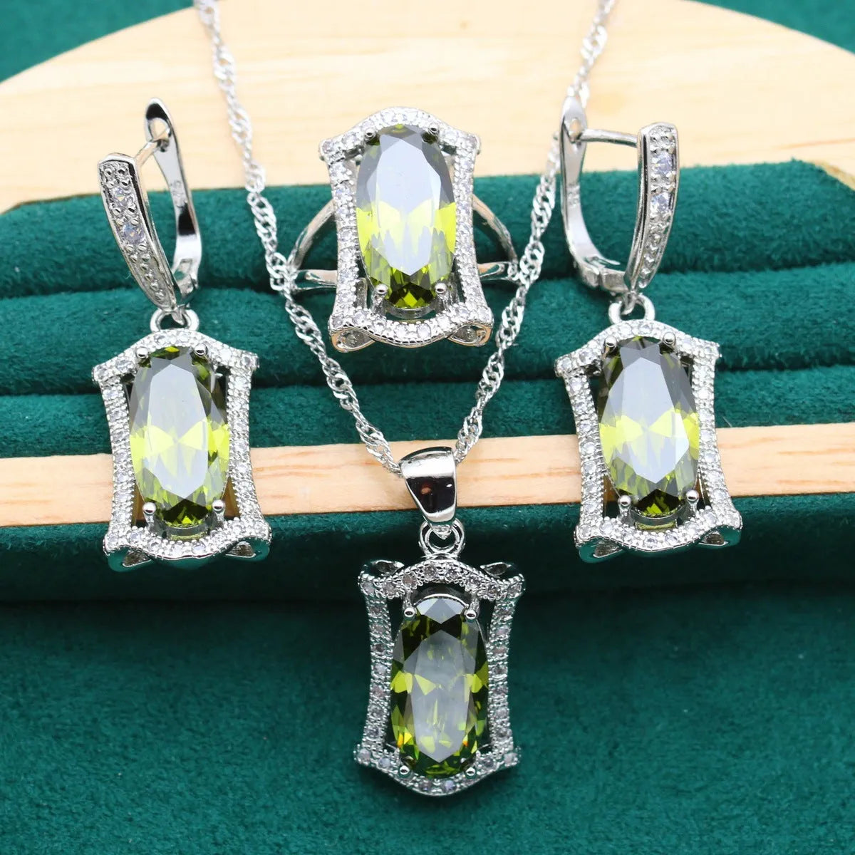 Anti-allergy zircon jewellery set with snake bone chain necklace, earrings, ring, and bracelet in yellow or olive.