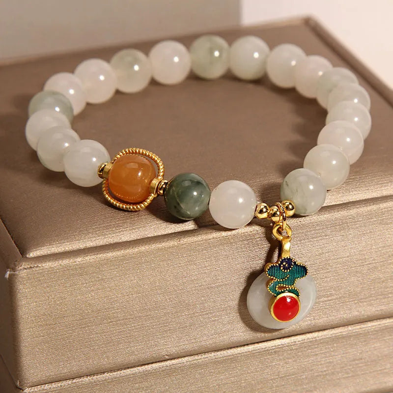Women's ice jade crystal bracelet with pearl elements and xiangyun peace jade buckle