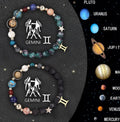 Two natural stone beaded bracelets with zodiac sign charms on a wooden surface.
