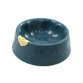 Green plastic double pet bowl with flower shape and separate food and water compartments.