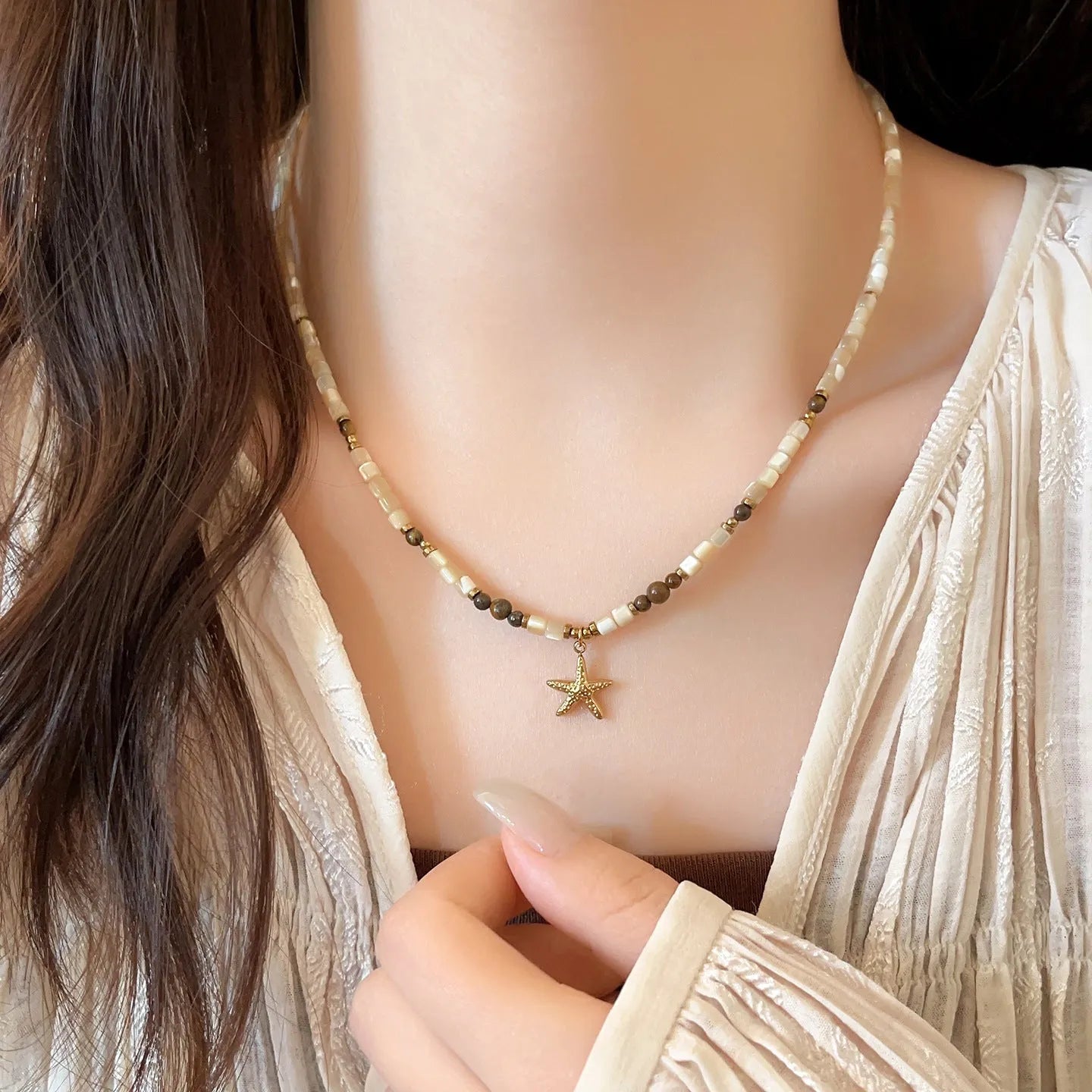Titanium steel starfish pendant necklace with natural shell and tigereye beads on a Maillard style chain