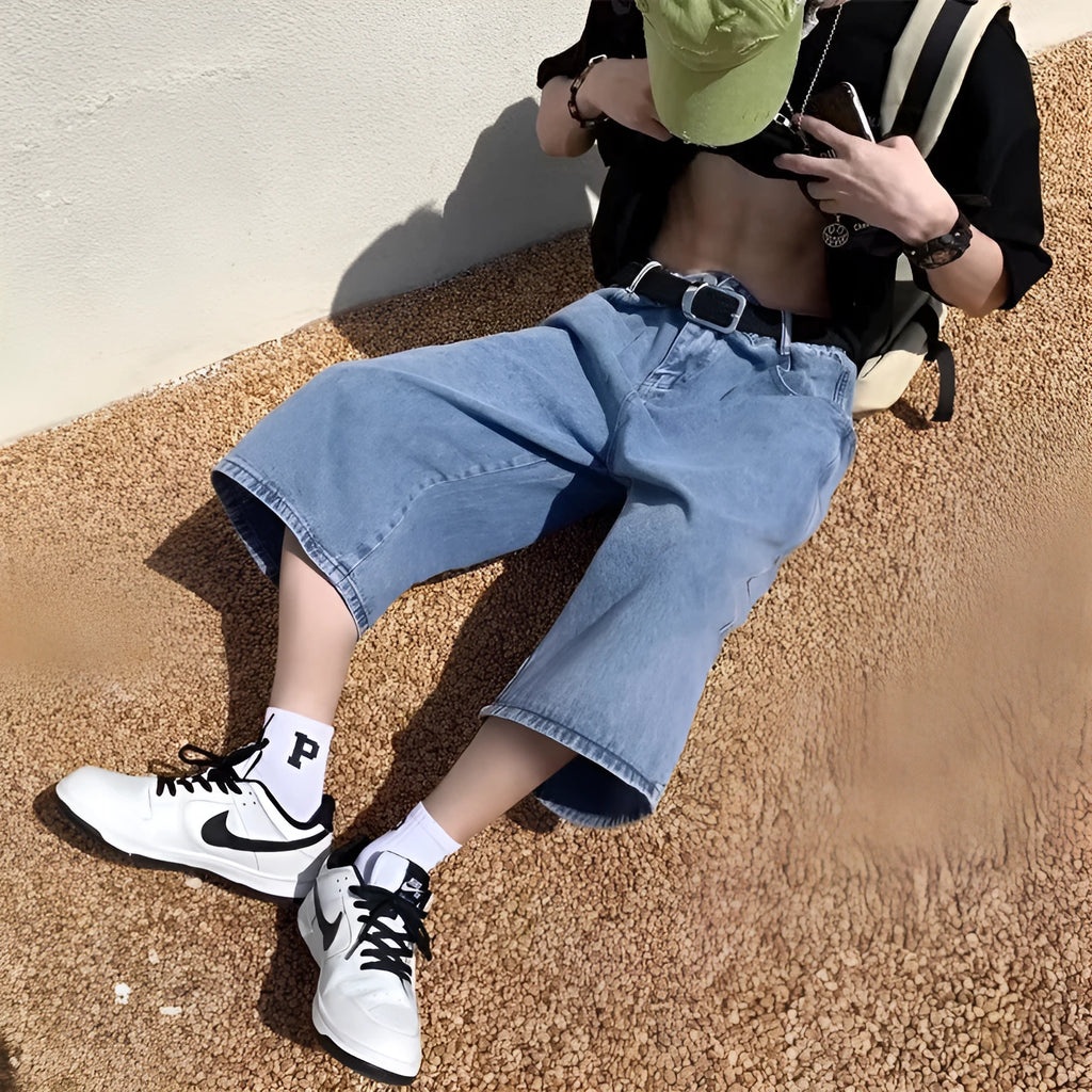 Men's blue washed denim pirate shorts with a cropped length, high waist, and straight leg cut.