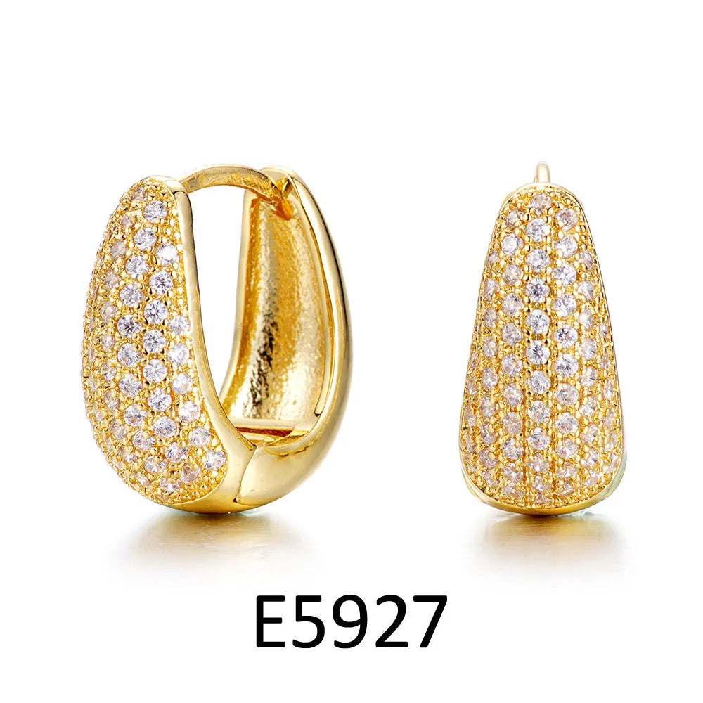Brass gold plated heart-shaped clip earrings with simple zircon accents and gang drill elements