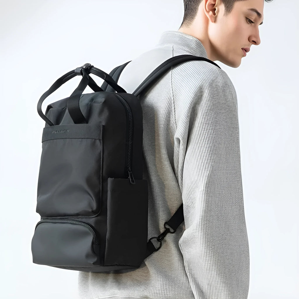 Black oxford cloth computer backpack with a 20-35 litre capacity and polyester lining.