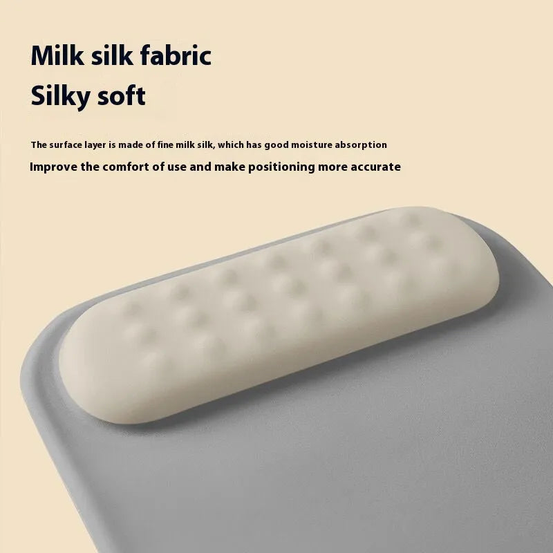 Ergonomic mouse pad with integrated wrist strap on cloth silicone surface