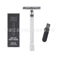 Traditional manual shaving razor and brush set in silver and black finish on a wooden surface.