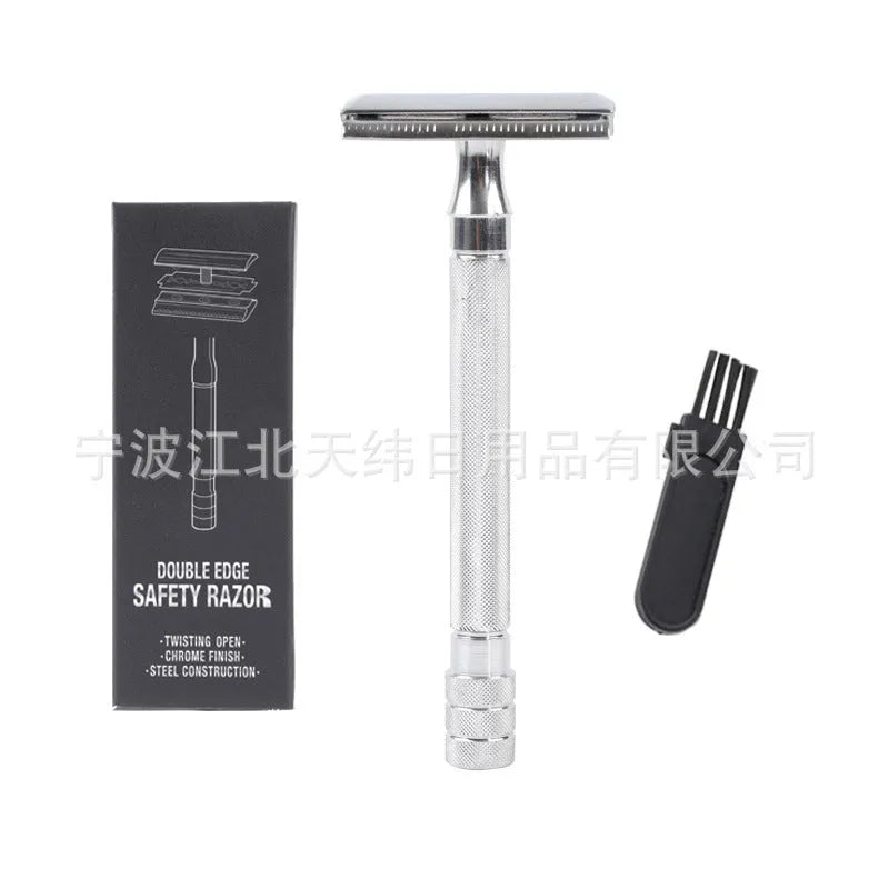 Traditional manual shaving razor and brush set in silver and black finish on a wooden surface.