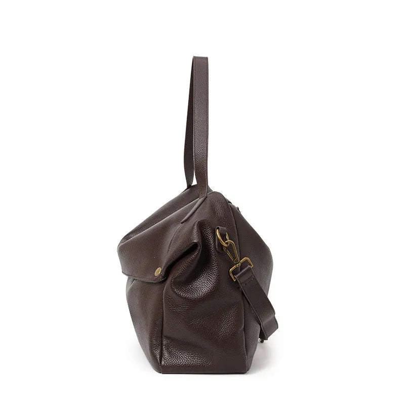 Brown genuine leather women's commuter shoulder bag with horizontal square shape showing interior zipper change pocket