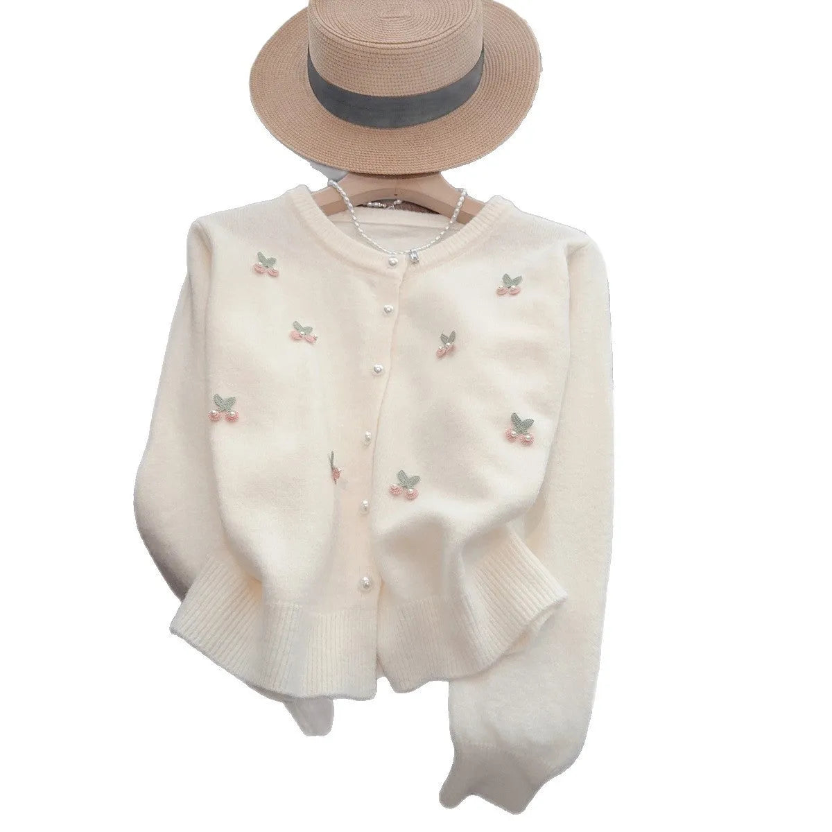 Women's slim fit cashmere cardigan with bead details on hanger, showing gentle round neckline in pink colour.