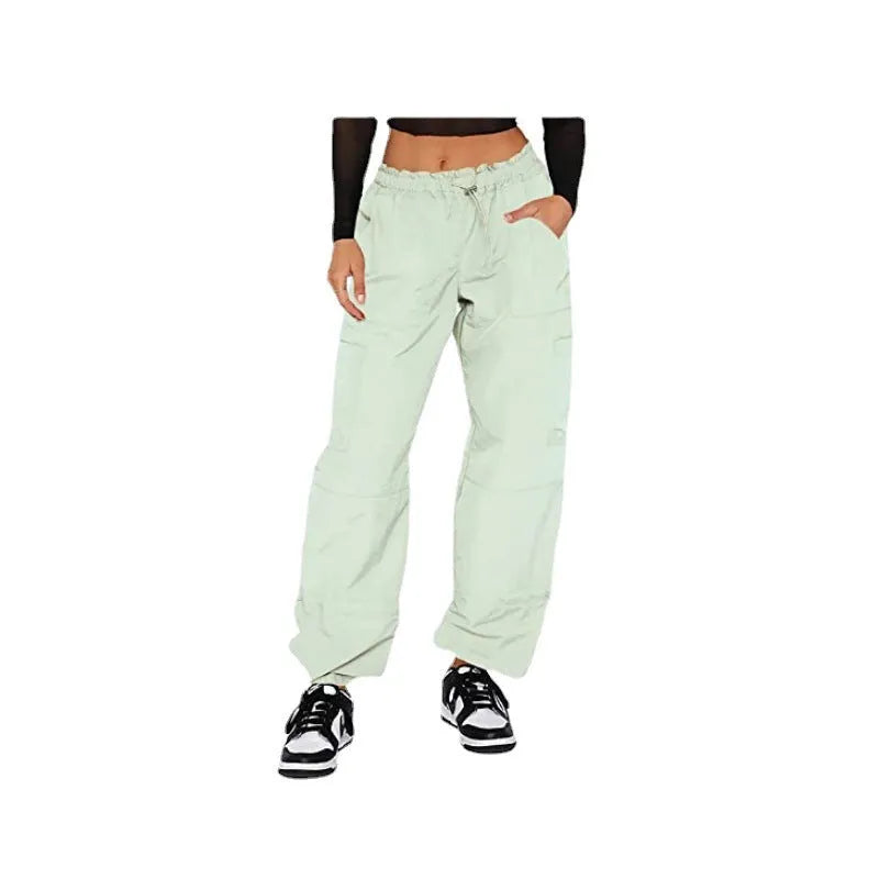 Men's loose-fit multi-pocket cargo casual trousers in polyester fabric on a hanger.