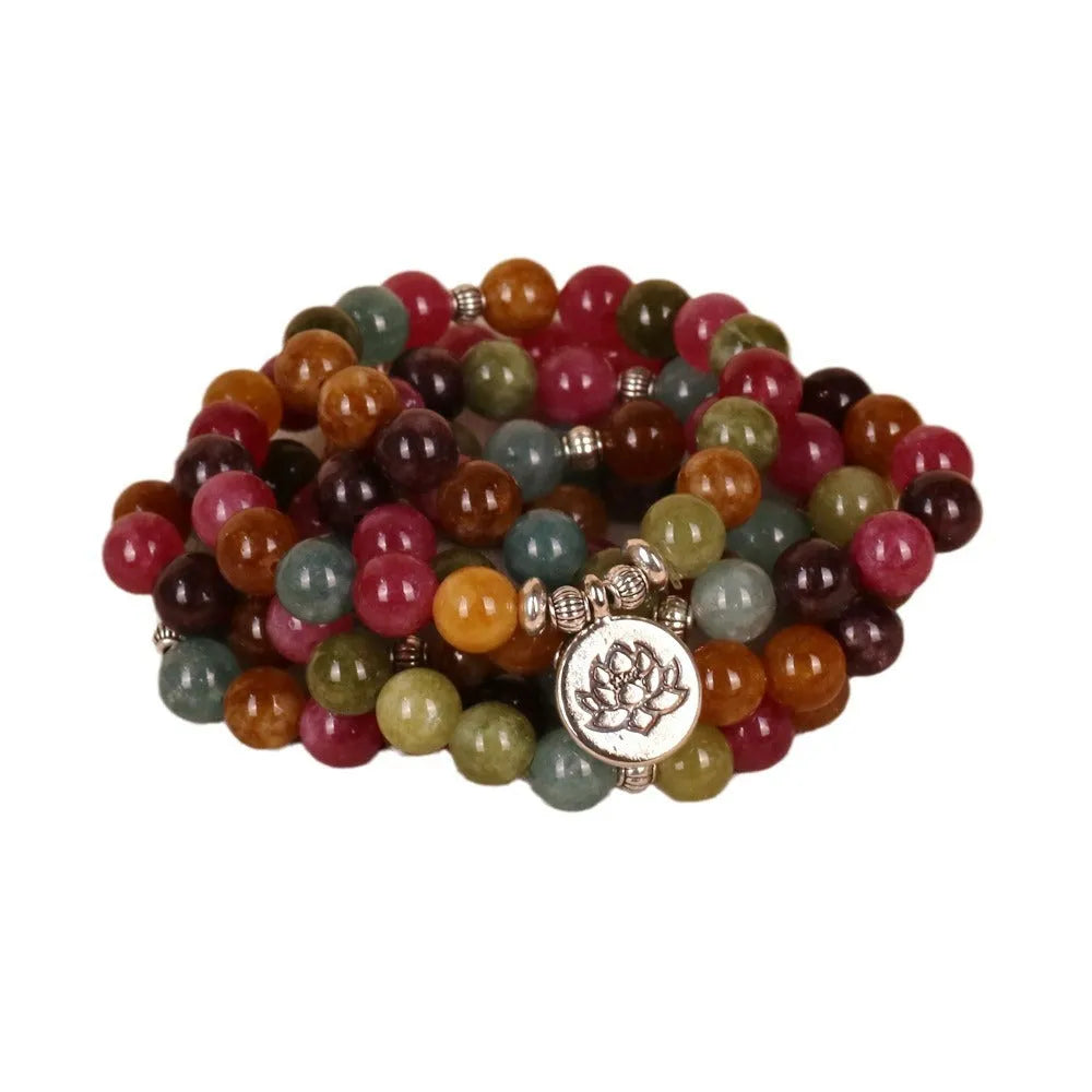 108-bead multi-layer lotus hanging bracelet in a tourmaline colour with alloy construction.
