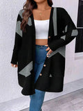 Black loose fit knit cardigan coat with button front on a hanger.