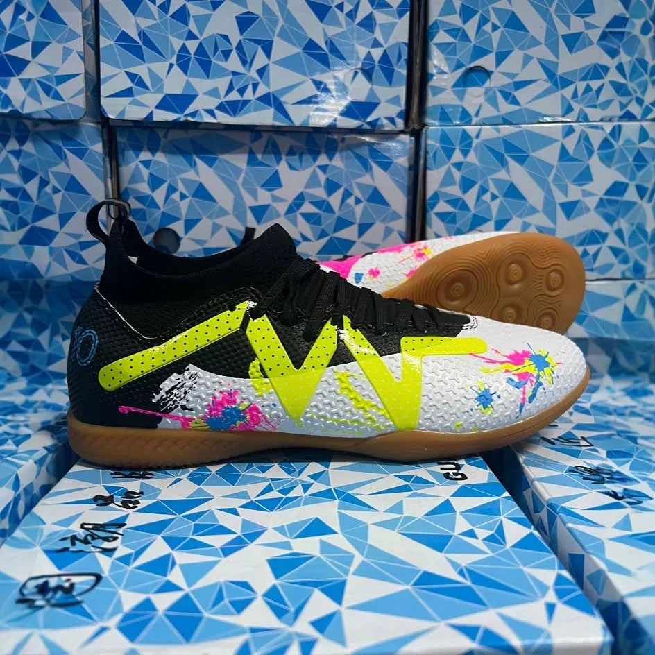 Adult low-top football boots in Black and Yellow colour with mesh lining and rubber sole.
