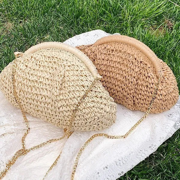 Women's shell-shaped straw shoulder bag with paper construction and zippered interior compartment