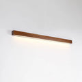 Walnut-coloured linear wood and acrylic strip wall lamp mounted on a light wall.