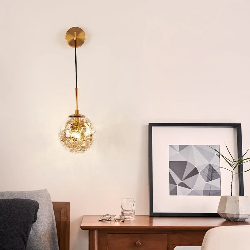 Modern glass wall lamp with minimalist design shown in bedroom setting