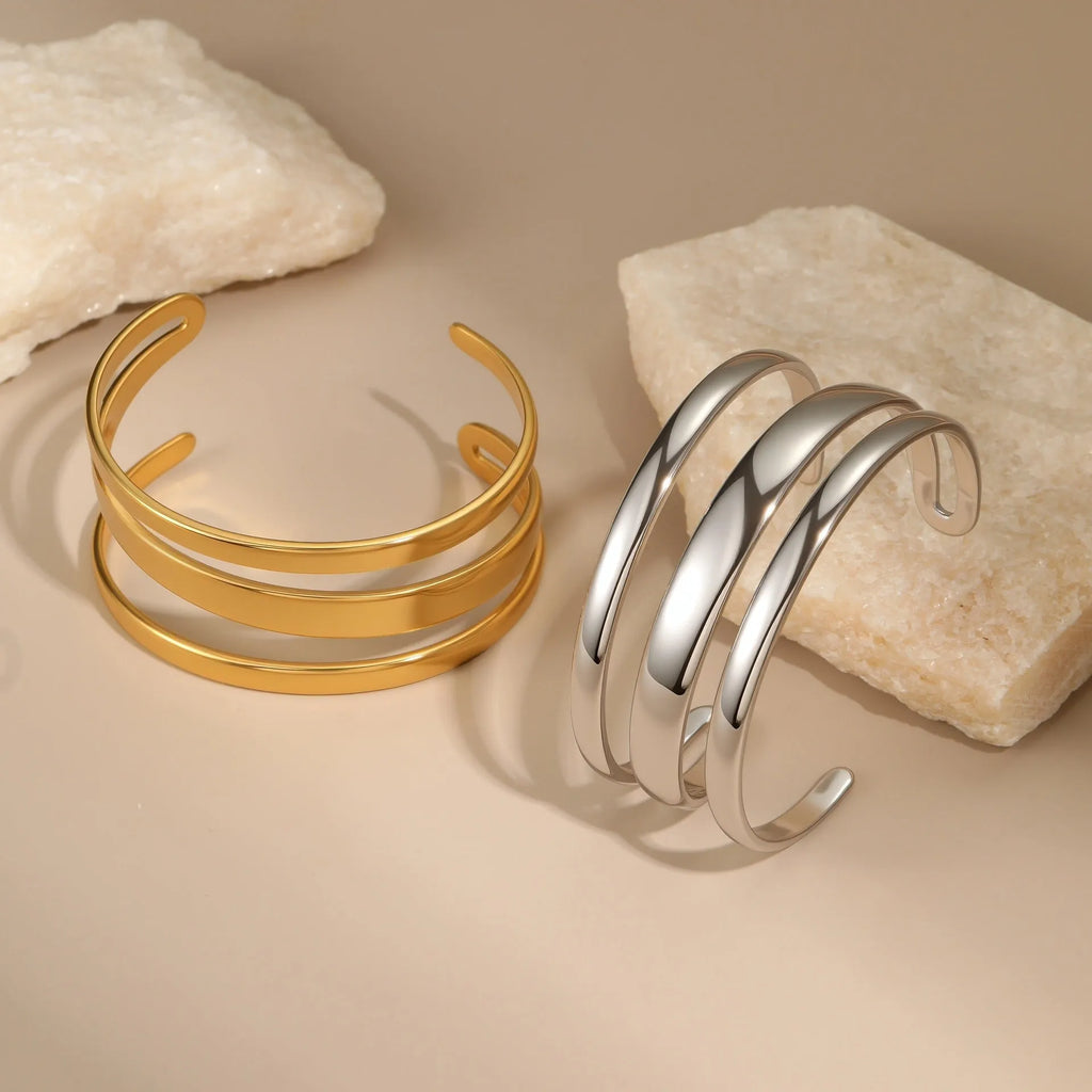 Women's stainless steel opening bracelet with geometric line design in gold or steel colour with 18K electroplated finish