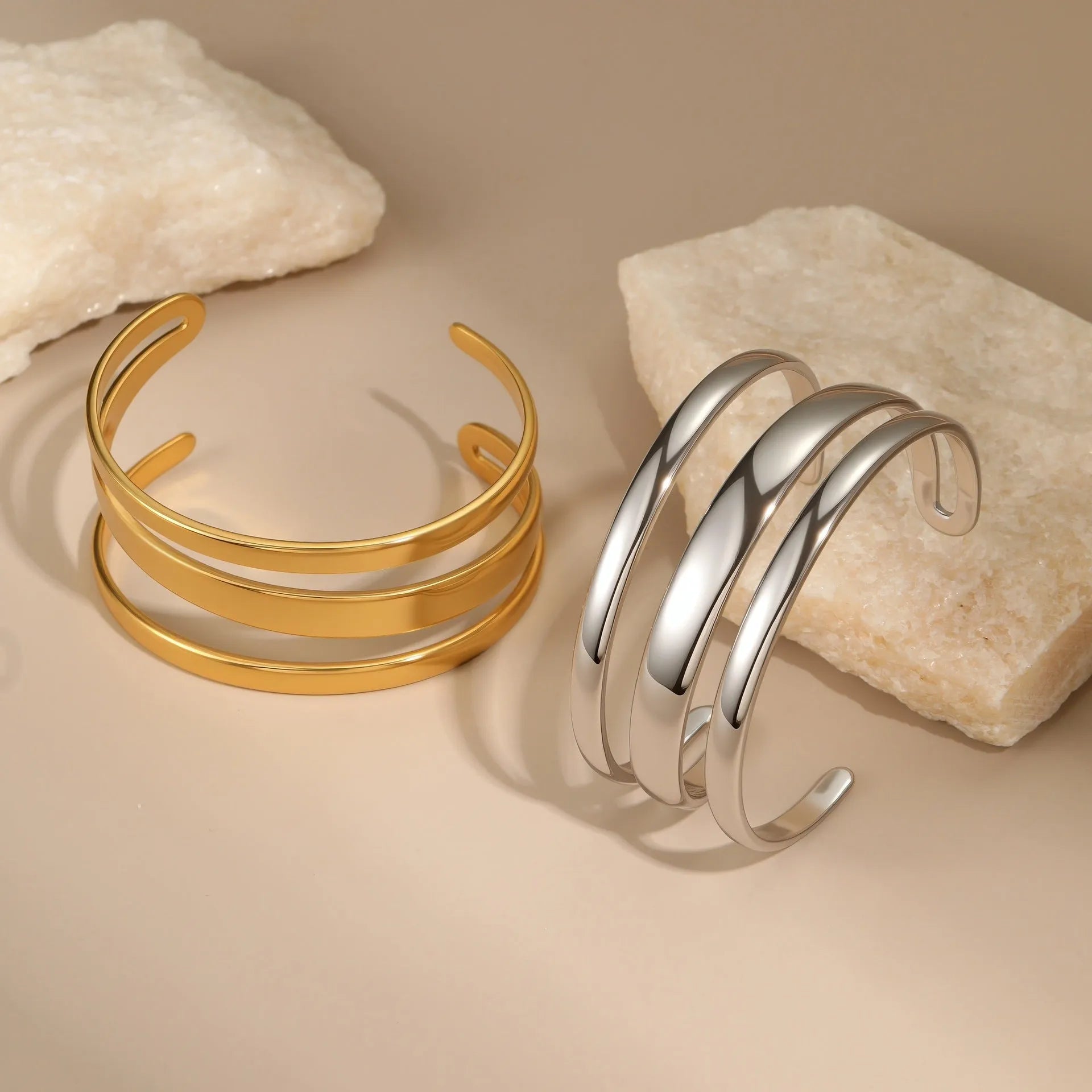 Women's stainless steel opening bracelet with geometric line design in gold or steel colour with 18K electroplated finish