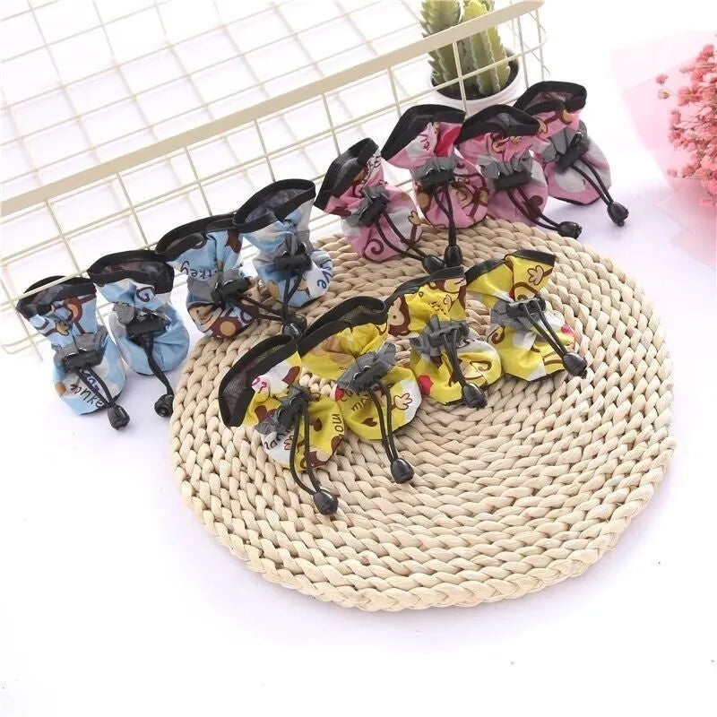 Set of four breathable cloth dog shoes with soft soles, shown in a choice of colours and patterns.
