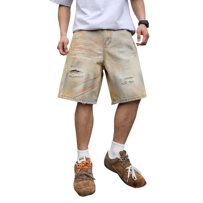 Light blue ripped denim shorts for men on a mid-thigh model, showing straight-leg cut and distressed details.
