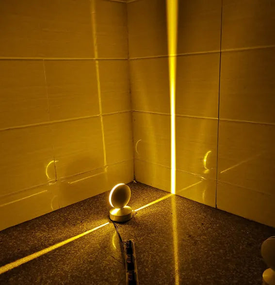 Modern aluminium LED spotlight bar wall lamp with glass lens, shown illuminating a corridor.