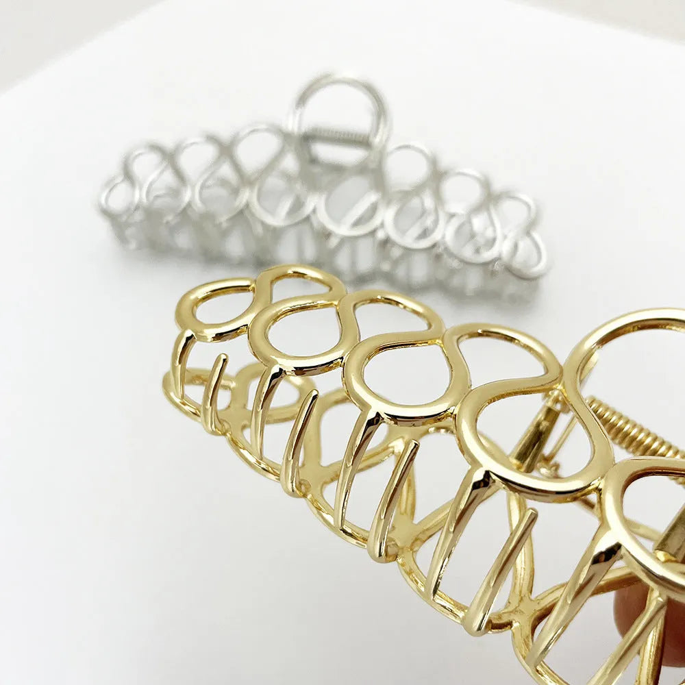 Large minimalist updo hair clip with tassel detail in gold or silver electroplated finish