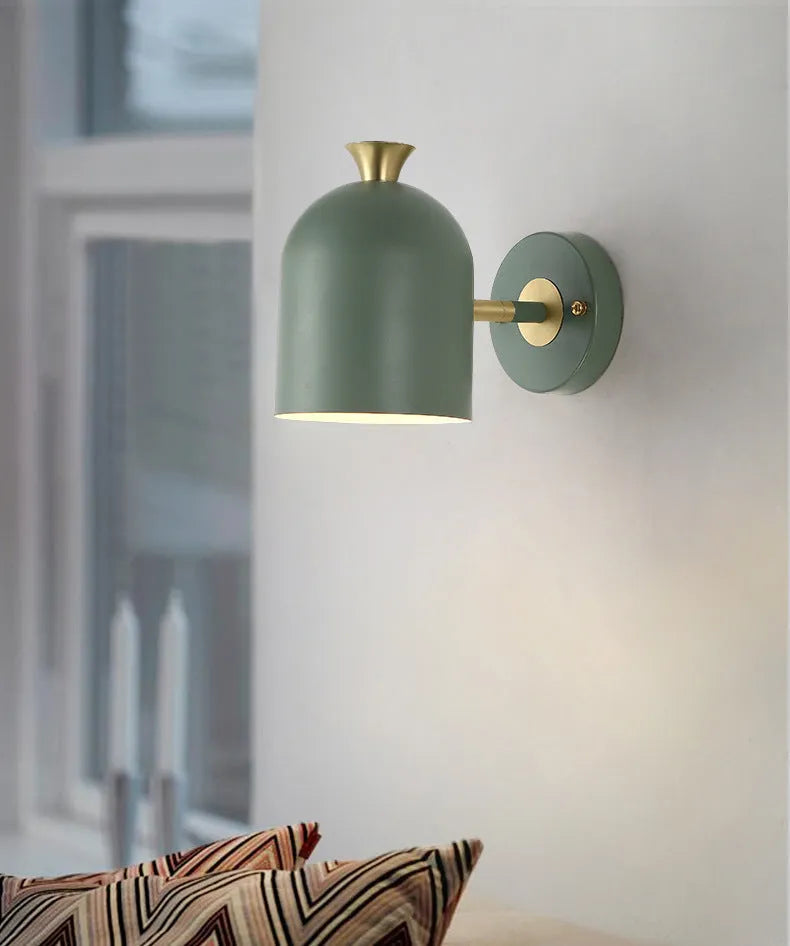 Single-head aluminium wall lamp with mirror front in choice of yellow, green, blue, or pink light.