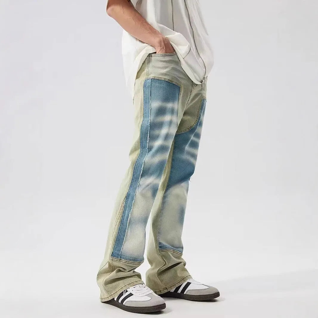 Retro patchwork jeans with splash-ink distressed design in yellow and blue colours
