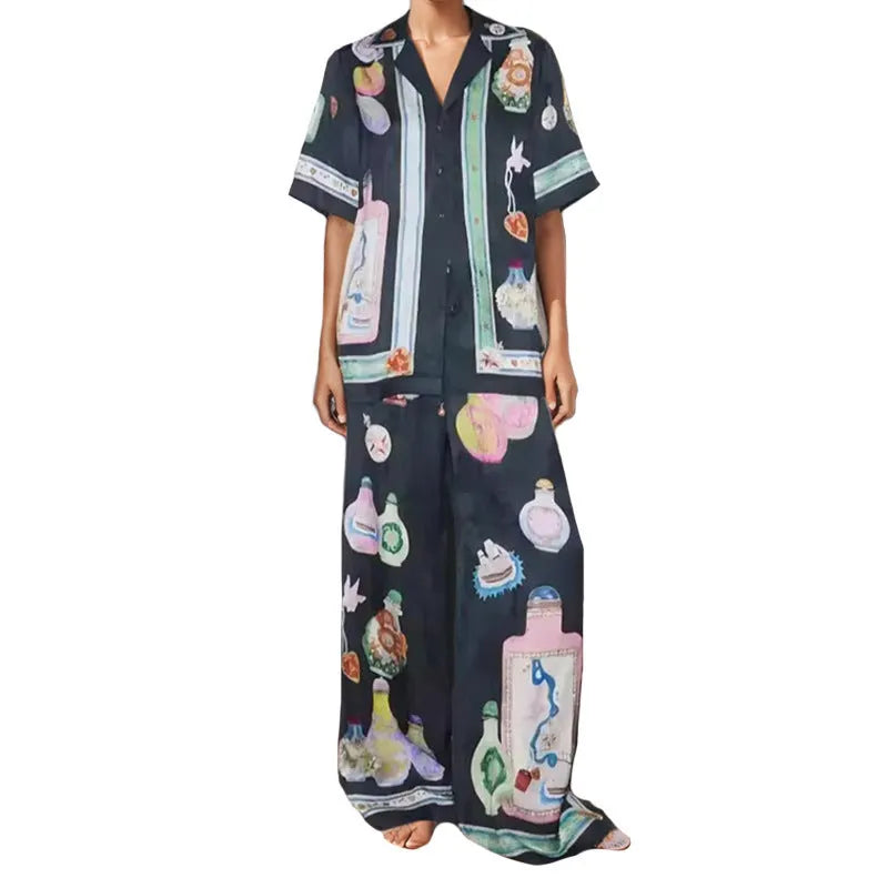 Black women's sleeve cardigan and trousers matching set with cartoon animation pattern.