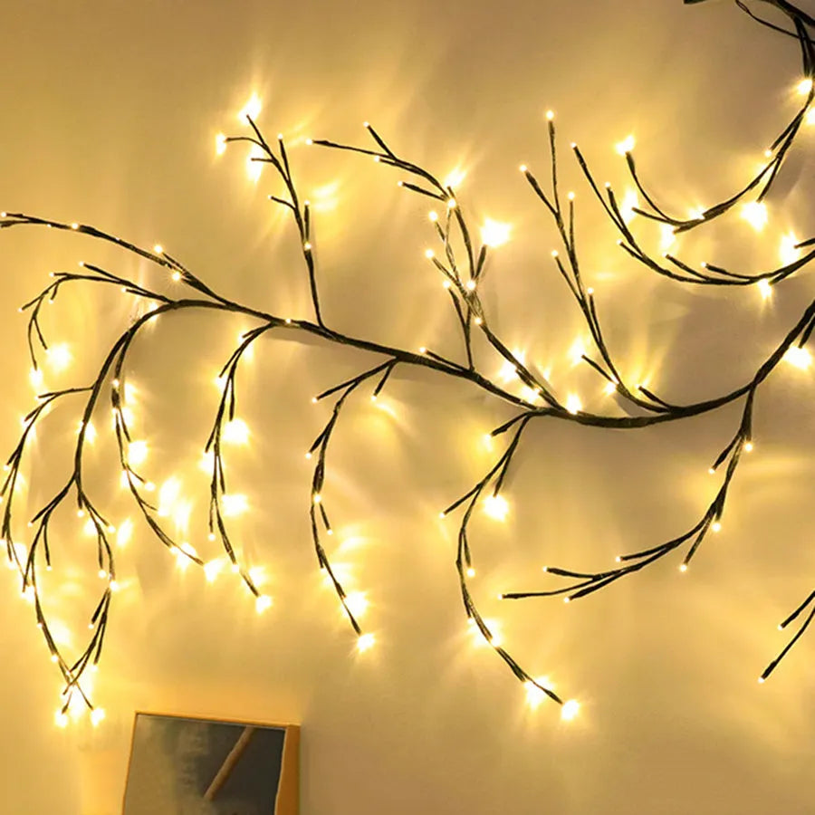 Flexible DIY willow vine LED light garland with warm white lights bent into a decorative shape.