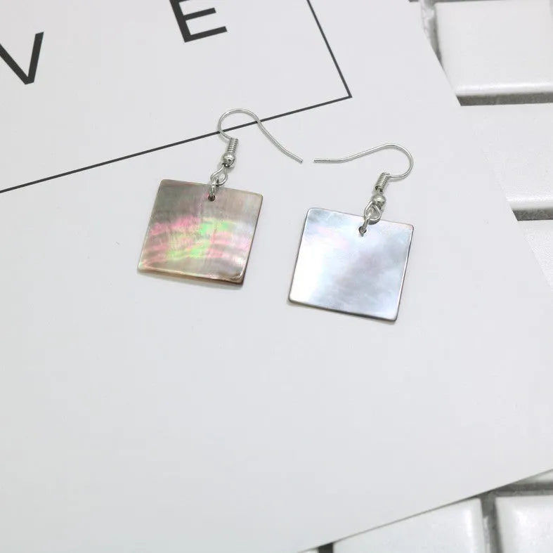 Geometric drop earrings made from natural shell in Square Panther or Rectangular Shell colour options.