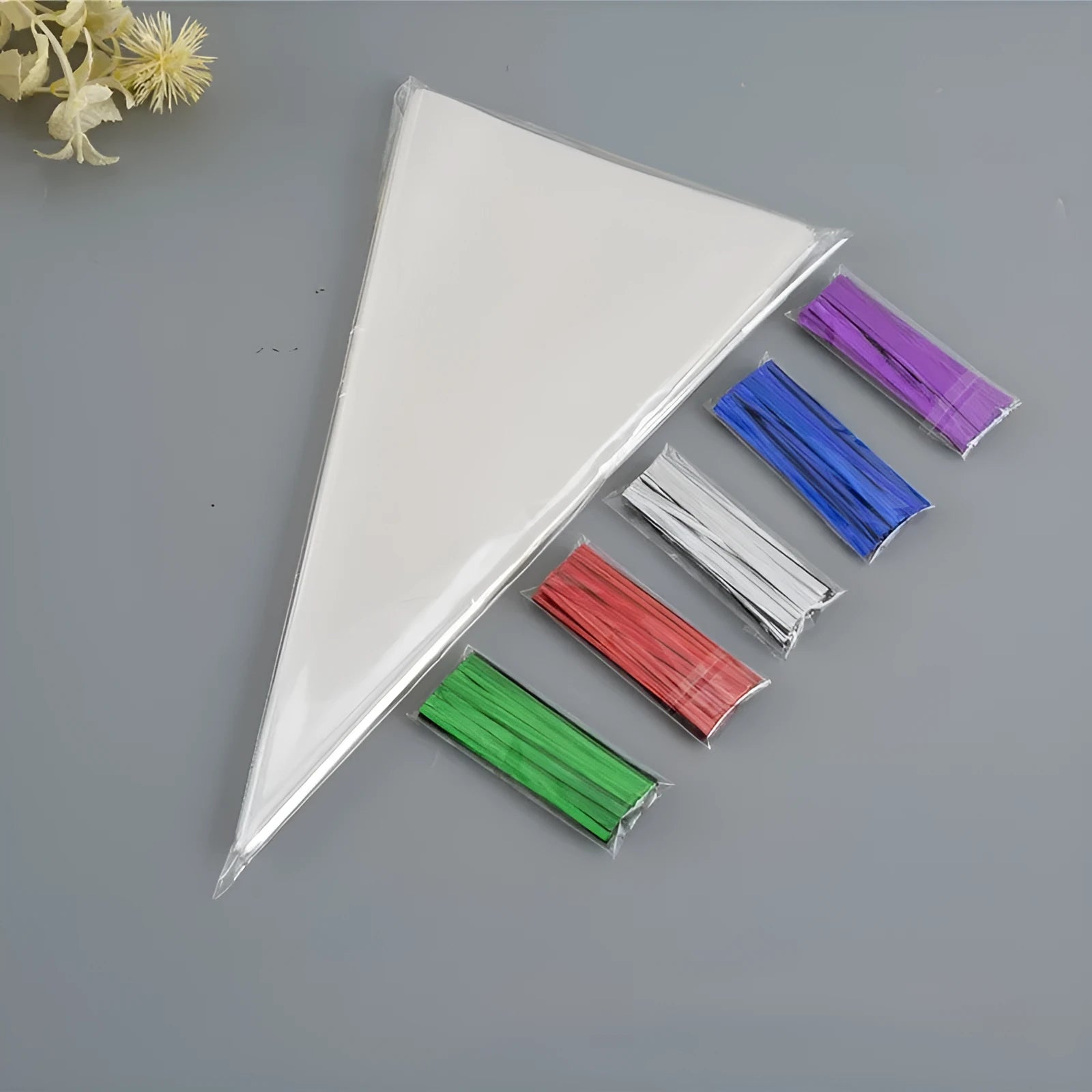 Triangle transparent plastic packaging bag with wire tie closure showing geometric shape
