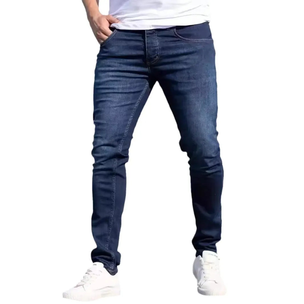 Men's dark blue slim fit jeans with skinny leg design and street fashion style