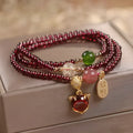 Natural garnet fox bracelet with adjustable rope closure in purplish red colour