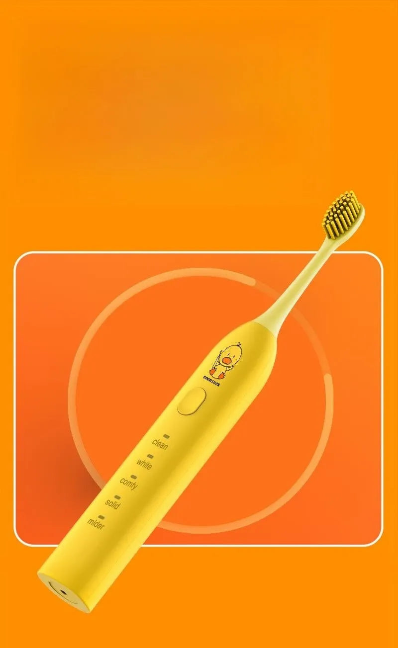 Rechargeable electric toothbrush with small yellow duck design, soft bristles, and USB charging cable
