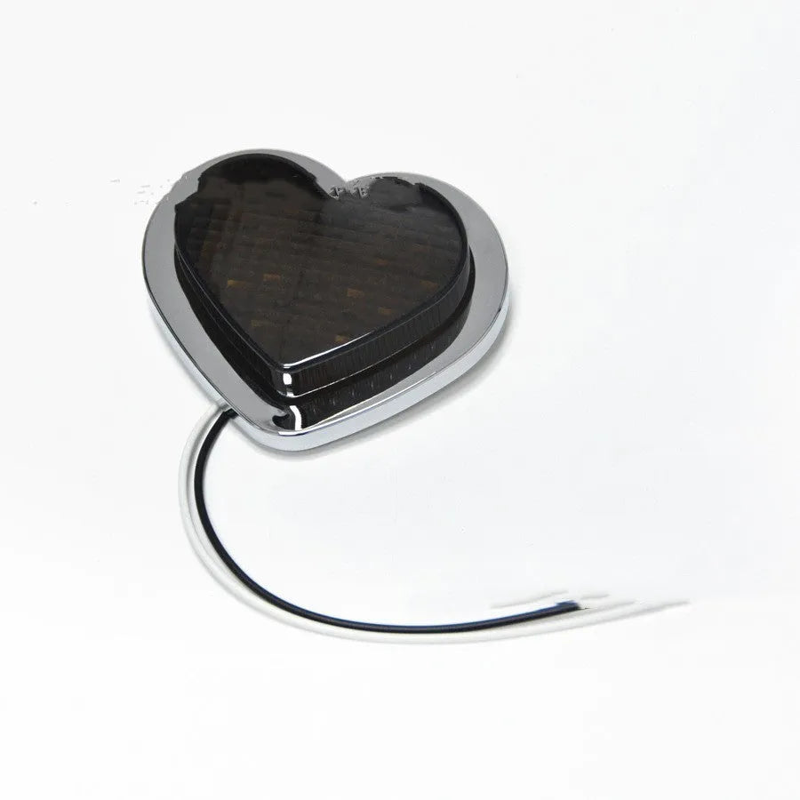 12V heart-shaped red LED automotive sidelight for fender mounting on a car.