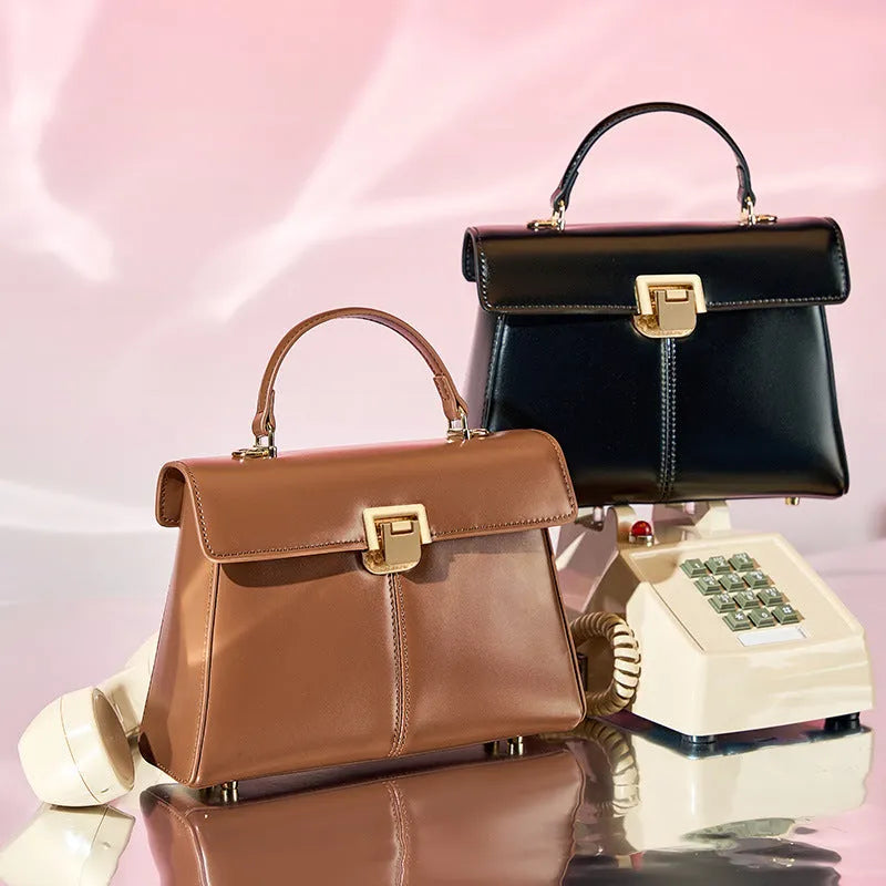 Women's black genuine leather shoulder bag with horizontal square shape and cover opening