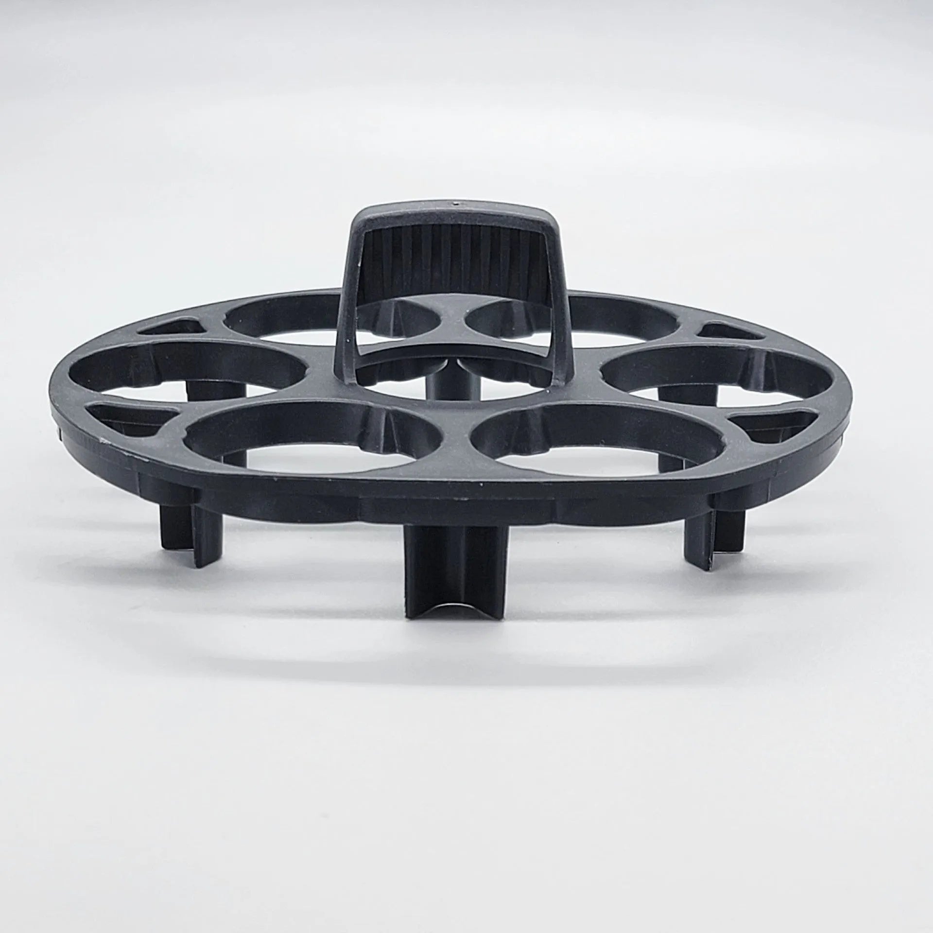 Black plastic egg holder measuring 13.8cm with retainer function for cooking machine storage