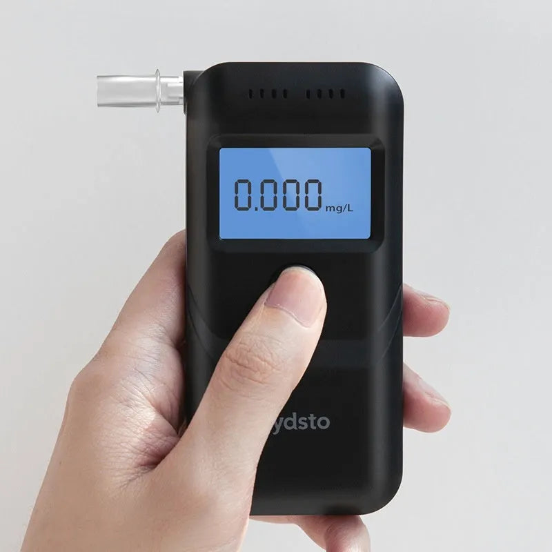 Black household alcohol tester breathalyser unit for personal drinking breath checks