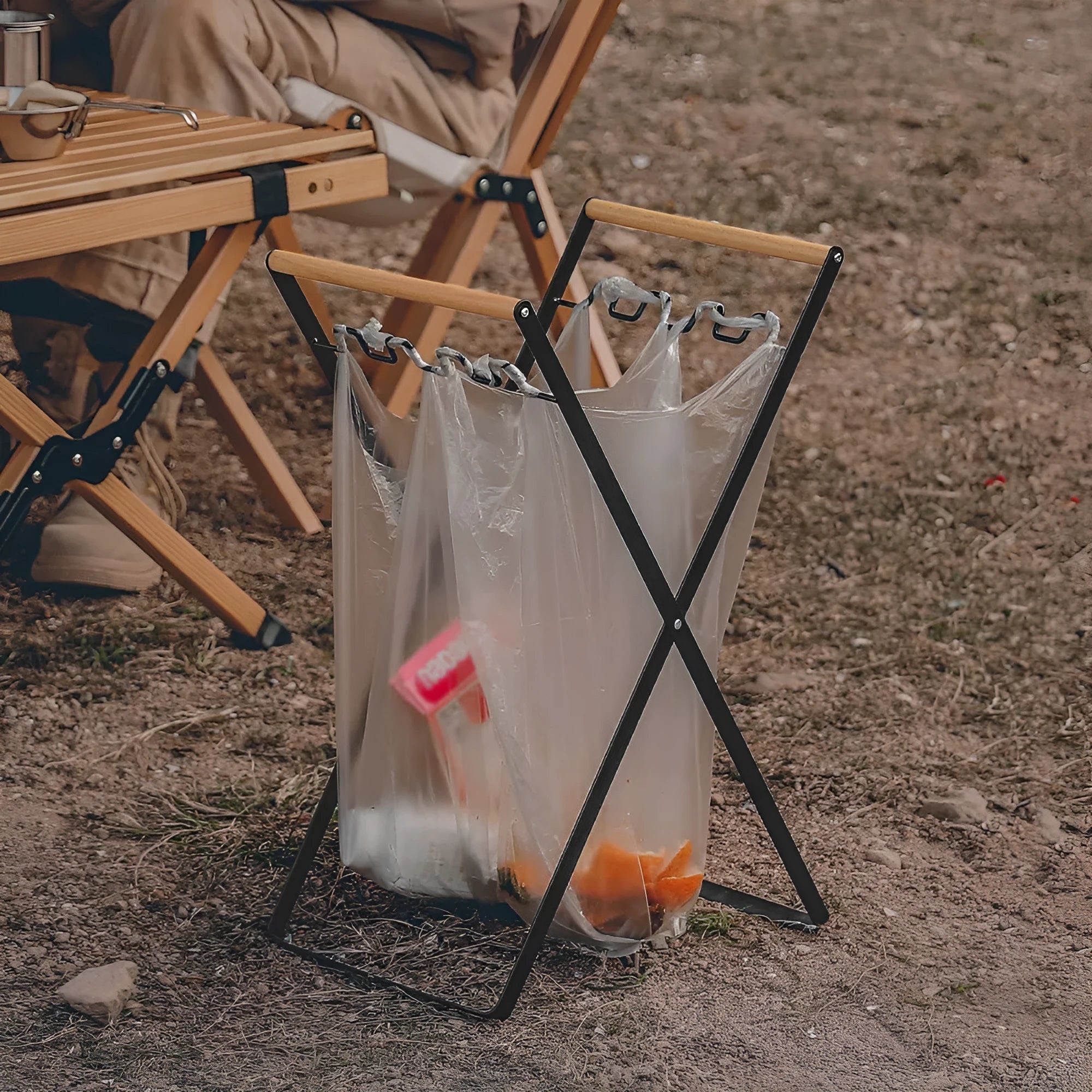 Iron and wooden folding trash storage rack for outdoor rubbish bags.