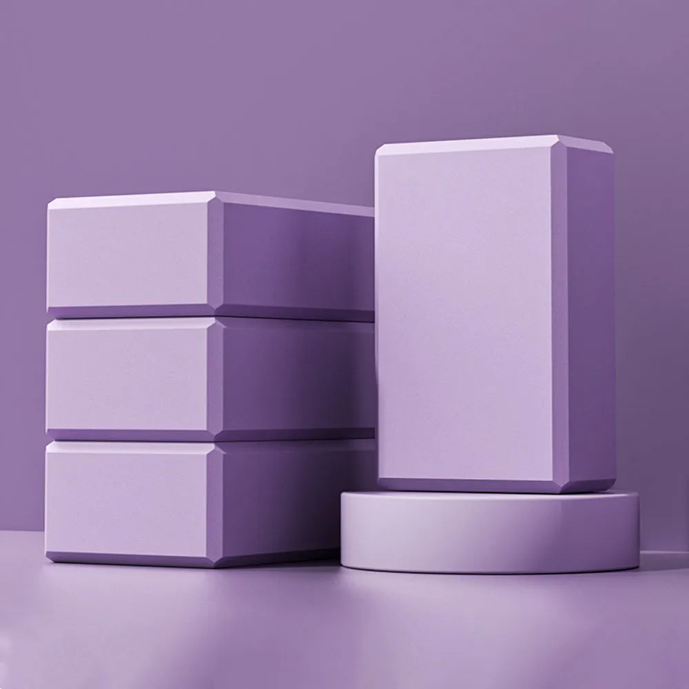 Blue high-density EVA yoga block on a gym mat
