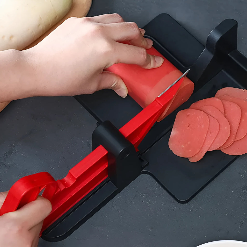 Green and red vegetable cutter with stainless steel blades for slicing carrots and potatoes